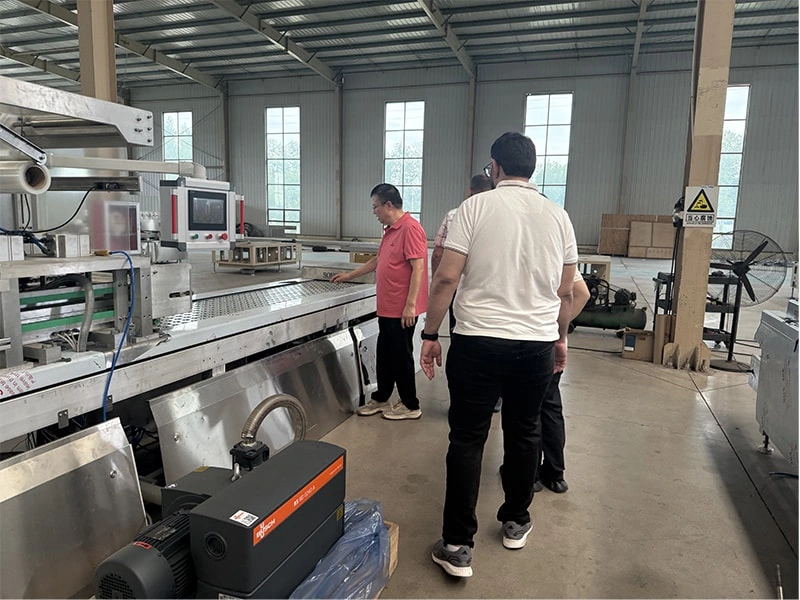 An overseas client from Morocco visited our company for an on-site inspection of our food vacuum packaging equipment.